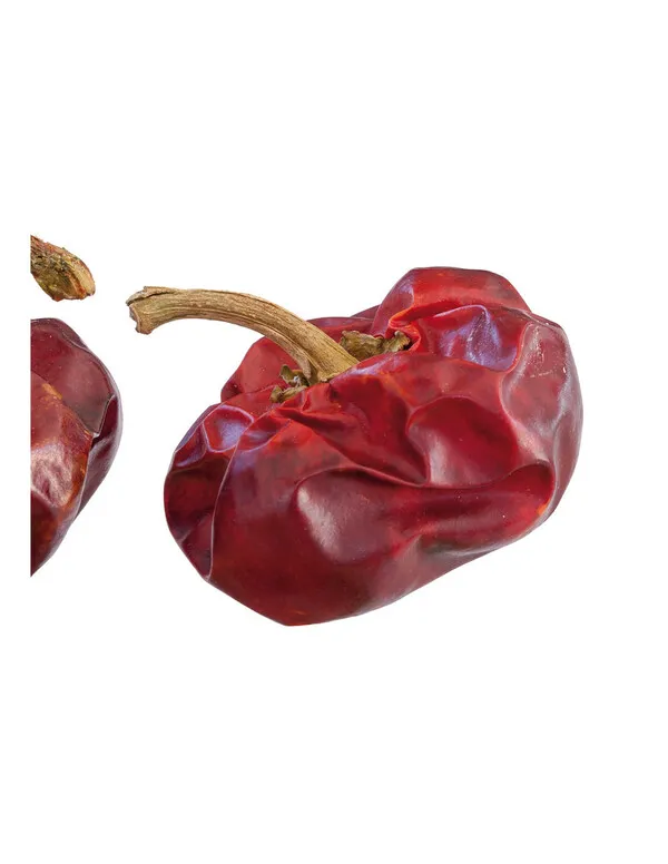 Pimientos ñora rojos secos con piel arrugada y brillante, mostrando el característico tallo curvado